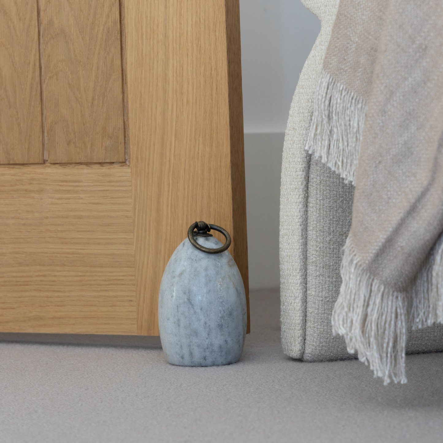 Grey Marble & Brass Door Stop featuring a sleek design with natural grey marble and brass handle, available at Clarkson Lee Lifestyle.