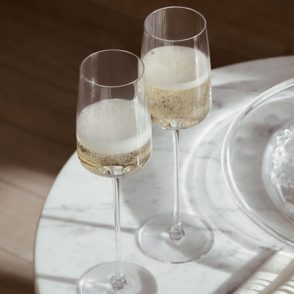 Set of 4 hand-blown champagne flutes, each uniquely crafted, available at Clarkson Lee Lifestyle.