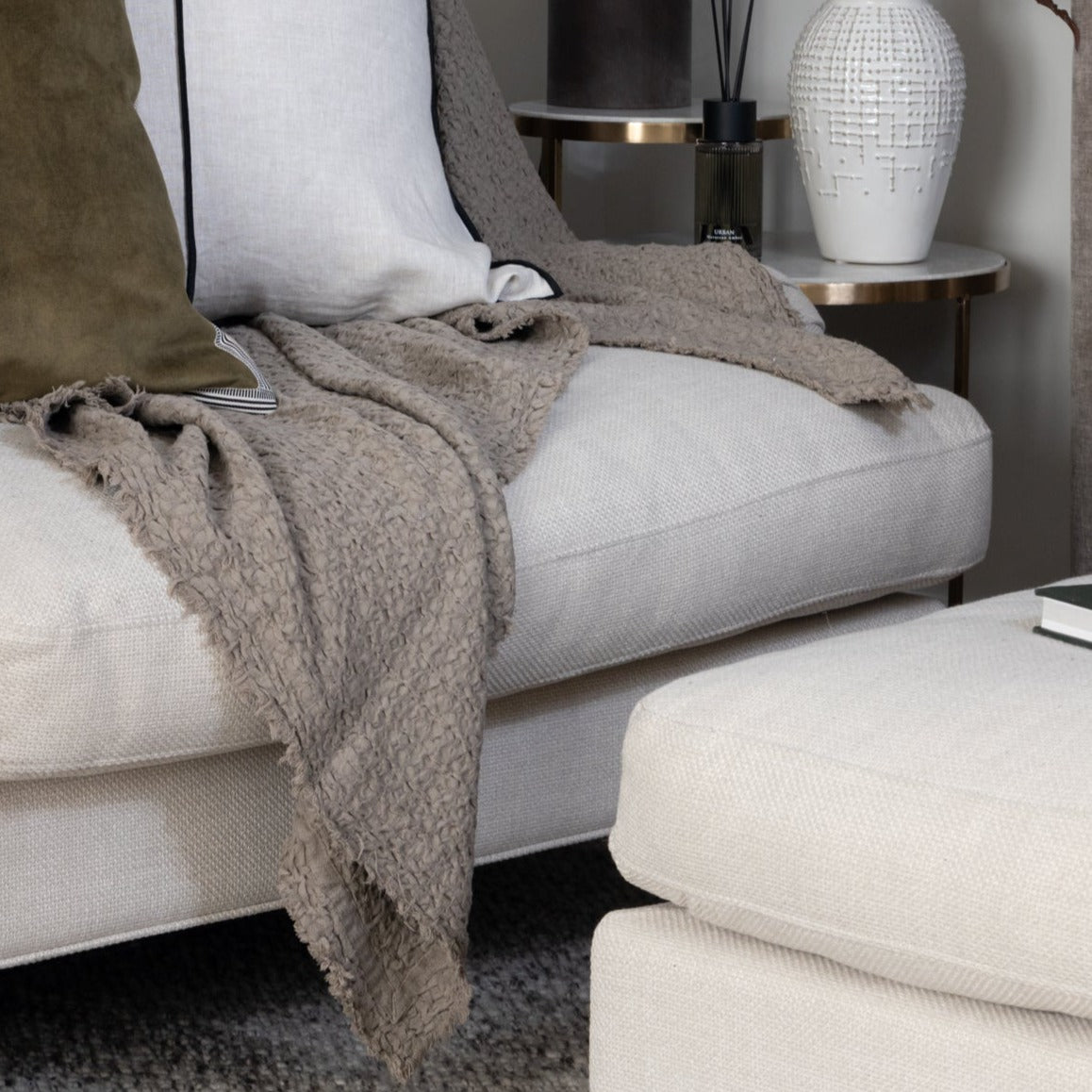 Luxurious Cotton Throw in Putty, woven in Portugal from pure cotton, available at Clarkson Lee Lifestyle.