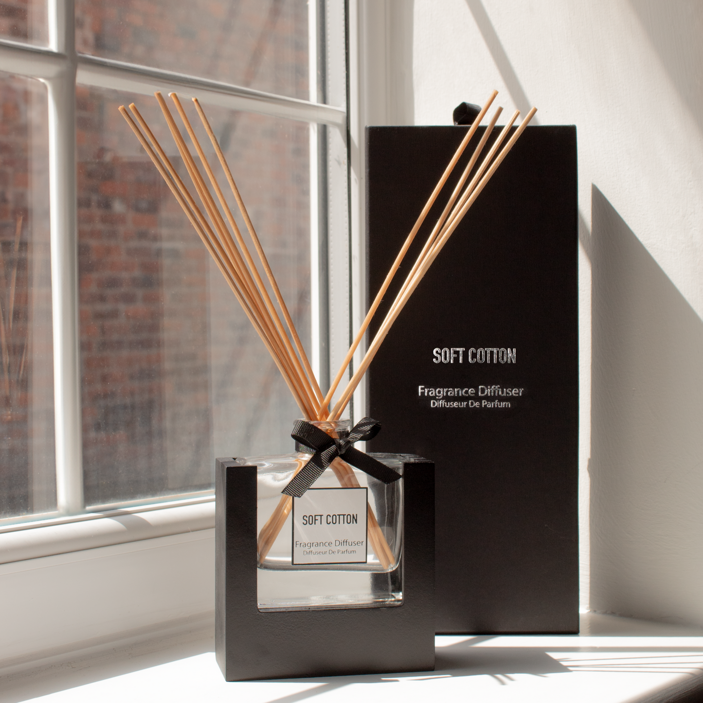 Soft Cotton Reed Diffuser with elegant glass bottle and natural reeds, available at Clarkson Lee Lifestyle.