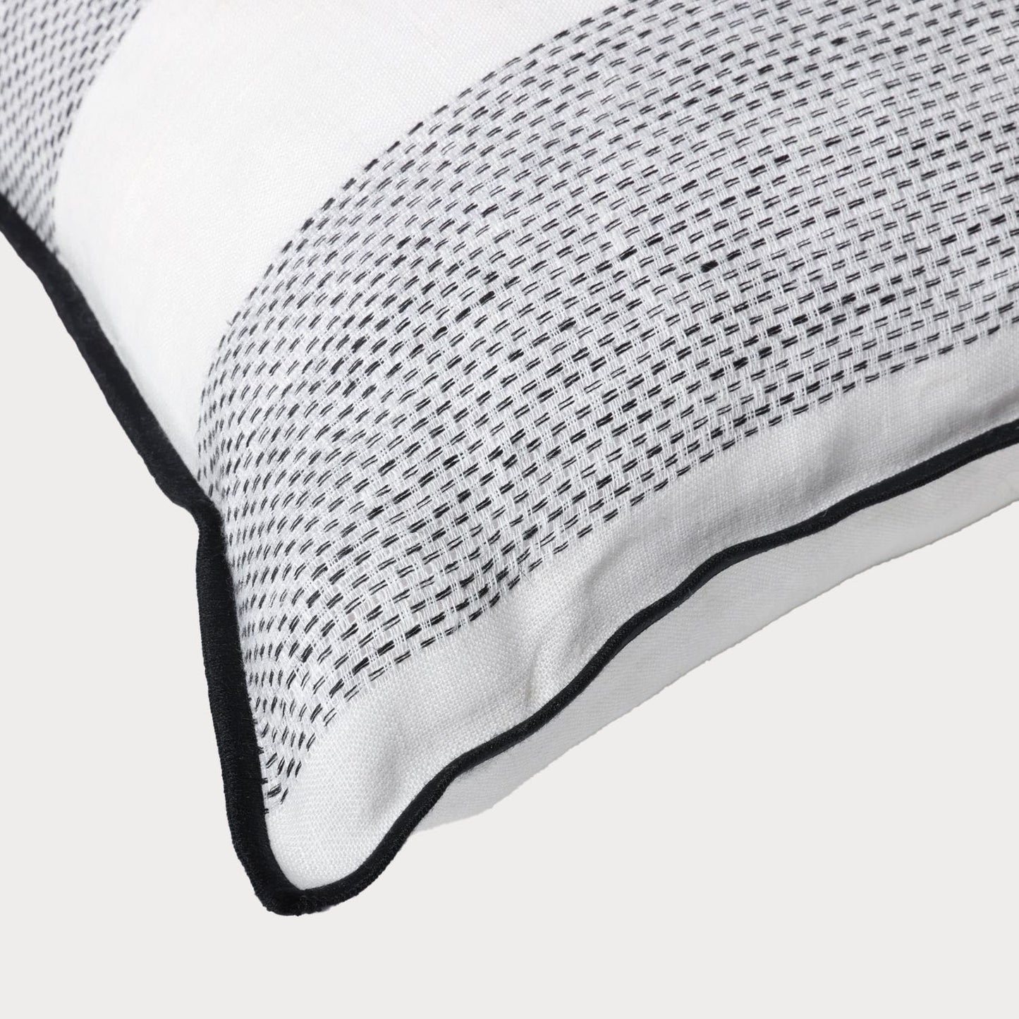 close of of the corner of the linen cushion showcasing its high quality craftsmanship