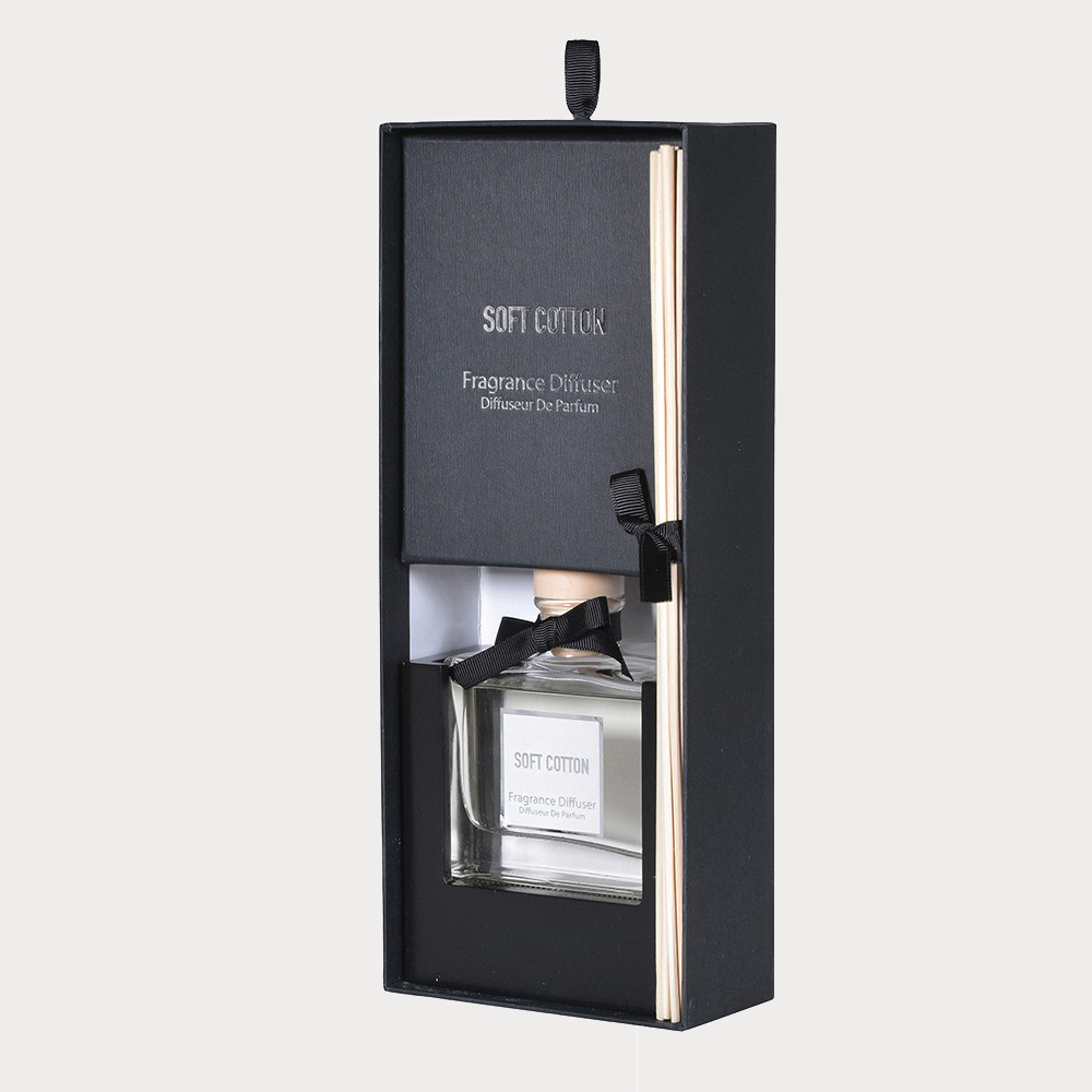 Close-up of Soft Cotton Reed Diffuser's glass bottle with natural reeds.