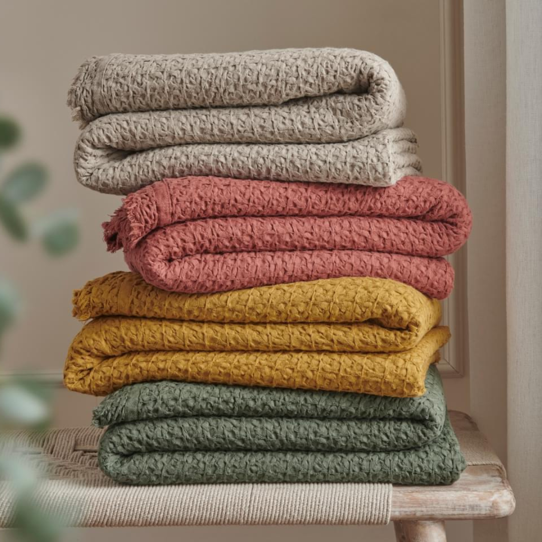 Close-up of the Cotton Throw in Putty showcasing its soft texture and high-quality weave.